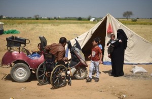 Fadi Abu Salah, com sua família em um campo de refugiados
